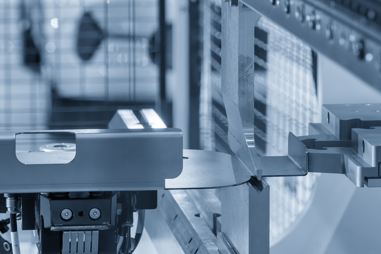 A closeup of automated panel bending equipment